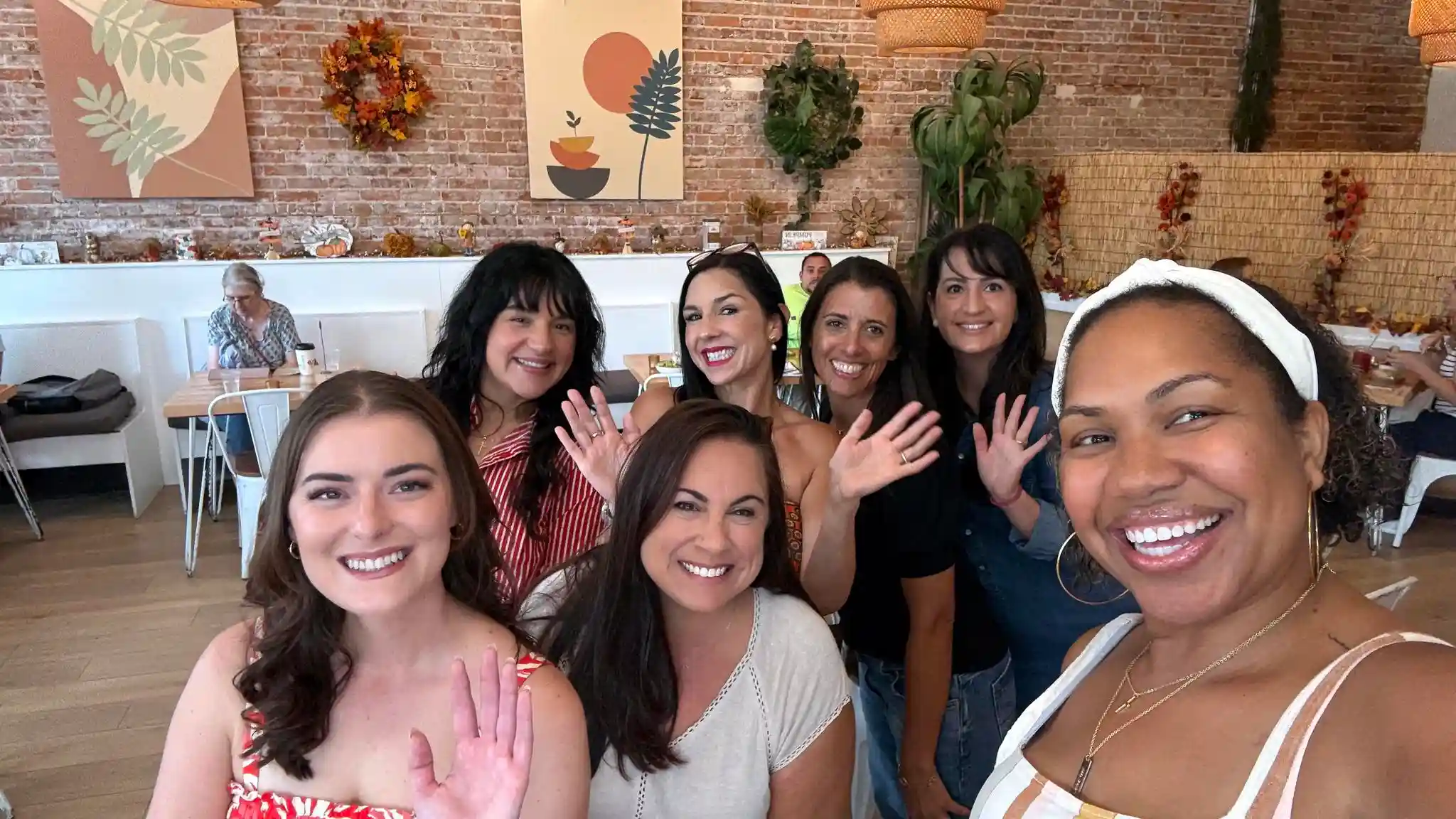 Angie with other branding photographers during a lunch meetup in Central Florida.
